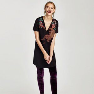 Zara. Mini black dress with print.